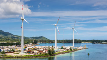 Wind turbines producing clean electricity in Victoria harbor, Mahe Island, Seychelles. Photo: Shutterstock/byvalet
